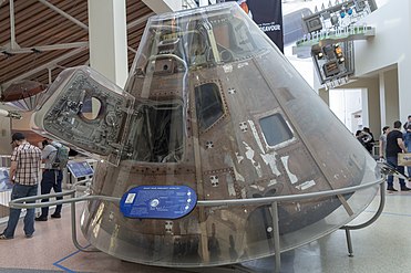 The door on the Apollo Command Module is an example of a simple developable mechanism because it conforms to the conical exterior of the Module, it moves, and its hinge line is aligned with the ruling lines of the conical surface. Apollo command module.jpg
