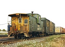 Typical American extended vision caboose BN caboose, Eola Yard, 1993.jpg