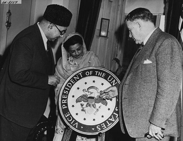 U.S. Vice President Alben W. Barkley explains the 1948 version of the Vice President's seal to Prime Minister Liaqat Ali Khan of Pakistan and his wife