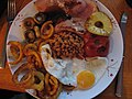 Boxing Day Dinner 2014 Gammon and pineapple with baked beans, mushrooms, tomatoes, curly chips and onion rings with a fried egg (15544259804).jpg