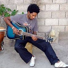 Bryan Art playing guitar in 2006. Bryan Art playing his guitar.jpg