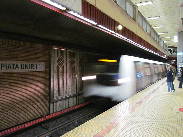 Metro Train entering Piata Unirii station