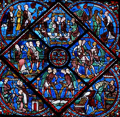 13th-century window from Chartres showing extensive use of the ubiquitous cobalt blue with green and purple-brown glass, details of amber and borders of flashed red glass.