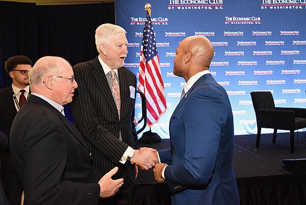 McMillen shakes hands with Maryland Governor Wes Moore, 2024