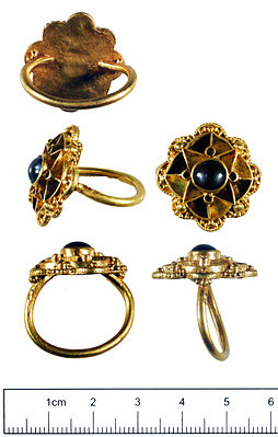 The Escrick ring of gold with a sapphire and glass inset