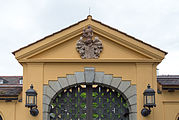 English: The Evangelische Akademie Tutzing in Tutzing. The entrance gate with coat of arms. Deutsch: Die Evangelische Akademie Tuzing in Tutzing. Einfahrt und Tor mit Wappen.