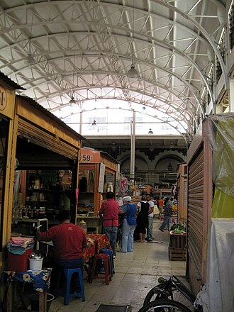 Food vendors at the market with the metal roof visible FoodVendorsAbRodMktDF.JPG