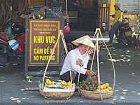 Decorating fruit stall for earning her living