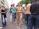 Nude girl distributing flyers at Love Parade