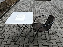 An outdoor table at a cafe in Krasno selo requiring a green certificate. Green certificate table IMG 20220111 145052.jpg