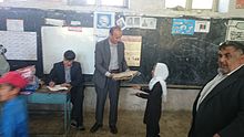 HASCO Founder Hafizullah Khaled distribute Backpack to an Afghan school child HASCO Founder.jpg