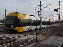 A two-unit METRO Blue Line train approaches 46th Street station from the south. Hiawatha Line 46th Street Station.jpg