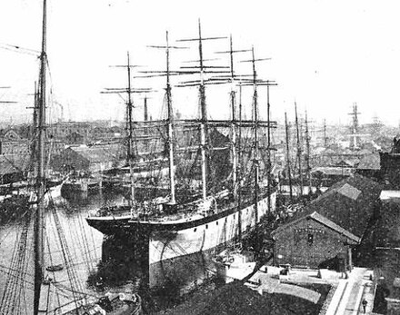 The Highfields alongside in a harbour with other ships of the time