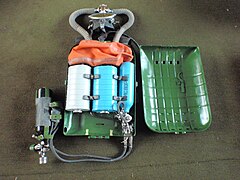 IDA-71 with lid of casing opened showing interior with counterlung, scrubber canisters and oxygen supply cylinder and regulator, and external nitrox supply plugged in
