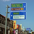 Gantry road sign with Transport typeface used in Malaysia