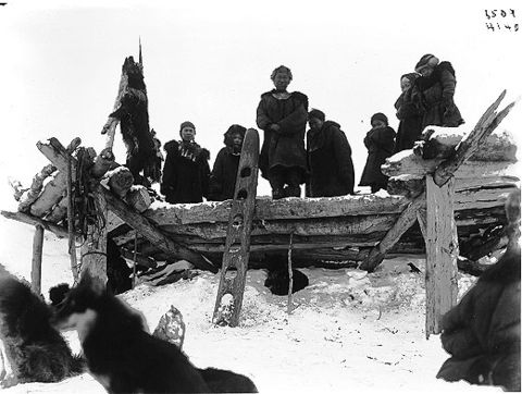 Koryaks at the roof of a dwelling.