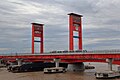 LRT Palembang Melintas di Samping Jembatan Ampera Palembang.jpg