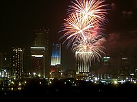 In addition to a fireworks show, Miami, Florida, lights one of its tallest buildings with the patriotic red, white and blue color scheme on Independence Day.