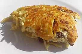 Noodle kugel made with curd cheese, eggs and raisins