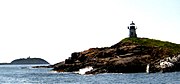 Pond Island and Light with Seguin Light in the background Pond Island Light Maine with Seguin 2009.jpg