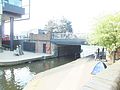 Guardian building and York Way bridge- and ridge of the homeless Mancunians tent