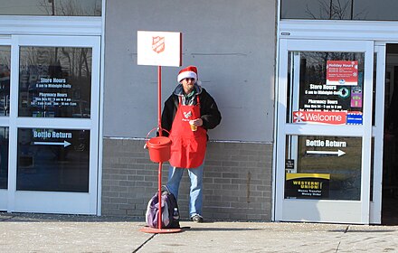 Red kettle at supermarket entrance, Ypsilanti, Michigan