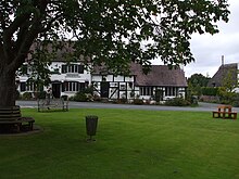 Samborne village green. Parish councils are quite often the custodians of common land and village greens. Samborne Village Green.jpg