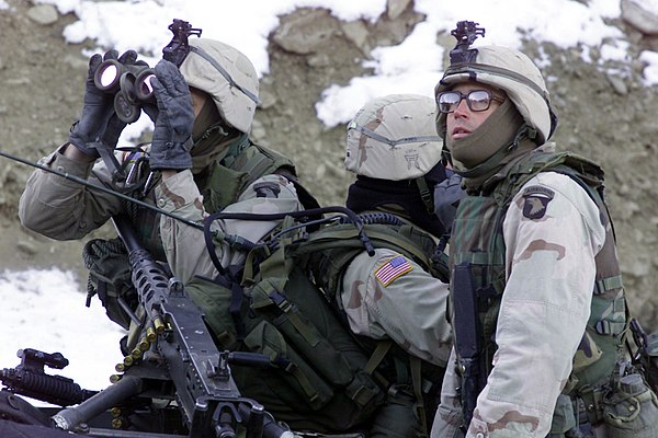 U.S. soldiers from the 1st Battalion, 187th Infantry Regiment, 101st Airborne Division (Air Assault), scan the ridgeline for enemy forces during Opera