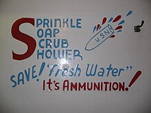 Slogan painted on the wall of a bathroom on the USS Alabama describing a navy shower Sprinkle, Soap, Scrub, and Shower.JPG