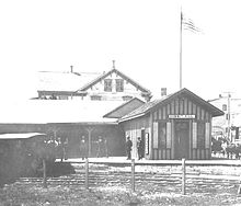 A Gilded Age train station sits at the summit terminus of what was one of the most important nine miles of railroad in the United States in the 1830s: the Mauch Chunk and Summit Hill Railroad, which later became the Mauch Chunk Switchback Railway. The Victorian building replaced the original offices, becoming one of the first train stations to host travelers. The first documented passenger traffic arrived in the later half of 1827 when the area down to Mauch Chunk, Pennsylvania was known as "the Switzerland of America"; regular passenger trains transported urban tourists from 1829 until early 1932. Summit Hill switchback station.jpg