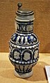 English: Jug with coat of arms; Salt glazed Stoneware with Cobalt decoration and pewter lid; c. 1600 made by Emont & Johann Mennicken, from the Westerwald; Charles W. Nichols Collection, "The Art of German Stoneware" 2012 exhebition.