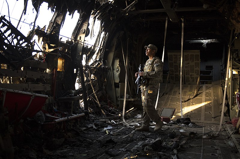 File:U.S. Air Force Airman 1st Class Christian Mejia, with the 376th Expeditionary Security Forces Squadron fly-away security team, guards a disabled C-130 Hercules aircraft at Forward Operating Base Shank in Logar 130606-F-YL744-185.jpg