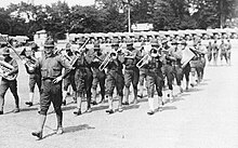 United States Army Ambulance Service Marching Band practicing at Camp Crane in the interior of the horse racing track, 1918 USAAC Band - Camp Crane 1918.jpg