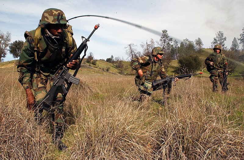 File:US Navy 030319-N-1485H-011 Personnel asigned to NMCB 40 set up a defensive perimeter in order to protect their convoy as they move through hostile territory during a training field exercise.jpg