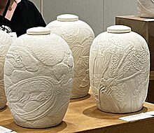 Julia Galloway's carved urns featuring Endangered Species Urns.jpg