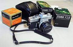 Vintage Minolta SR-T 101 35mm SLR Camera with MC Rokkor, PF 1-14, f = 58 Minolta Lens, Also 35mm F2.8 and 135mm F2.8 Lens (9102234387).jpg