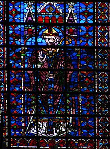 13th-century nave window representing a bishop