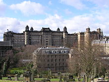 The rear of the Glasgow Royal Infirmary's 1914 Centre Block in the background with the Estates building in the foreground, viewed from the Glasgow Necropolis Wfm glasgow royal infirmary.jpg