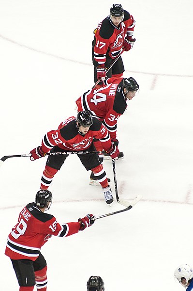Kovalchuk (top) playing for the New Jersey Devils, alongside Travis Zajac (#19, foreground), Nick Palmieri (#32), and Mark Fayne (#34).
