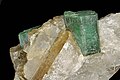 Emerald (beryl var.), its color is attributed to trace amounts of chromium, trace amounts of vanadium are possible too