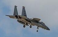 A US Air Force F-15C Eagle, tail number 84-0025, on final approach at Kadena Air Base in Okinawa, Japan. The aircraft is assigned to the 18th Wing.