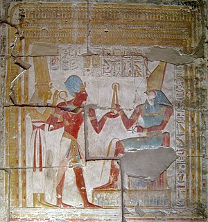 Relief in the temple of Seti I of pharaoh Seti I presenting an offering to Horus