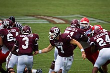 Goodson receiving a handoff from quarterback Stephen McGee in 2007 Aggie handoff 2007-09-08.jpg