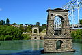 English: Piers of the old Alexandra Bridge over the Clutha River at Alexandra, New Zealand