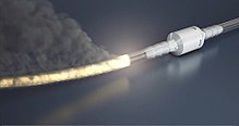 A fire in an oxygen tube approaching an oxygen firebreak Animated tube fire.jpg