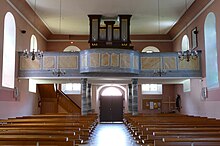 Vue intérieure de la nef vers la tribune d'orgue