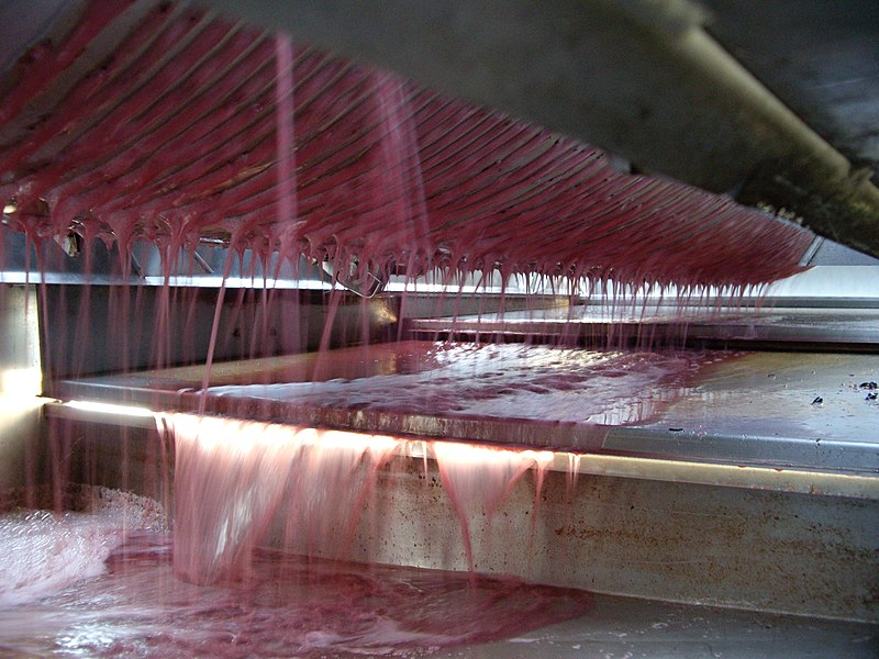 File:Cabernet Sauvignon juice falling into the press pan from mebrane press.jpg