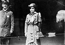 Likely taken after her arrest in Detroit, Michigan. Photograph back reads: "Rabinowitz on the way to the workhouse - Patrol Kindley (illeg.) by police department" Candid photo of Matilda Robbins.jpg