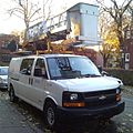 The original STM logo and the Chevrolet Express van.