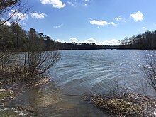 College Creek, as seen from the College Landing Archeological Site.  A bridge over the Humelsine Parkway is barely visible in the trees.